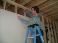 12-18-2004 Glenn Hege nailing up sheetrock  * 2592 x 1944 * (1.29MB)